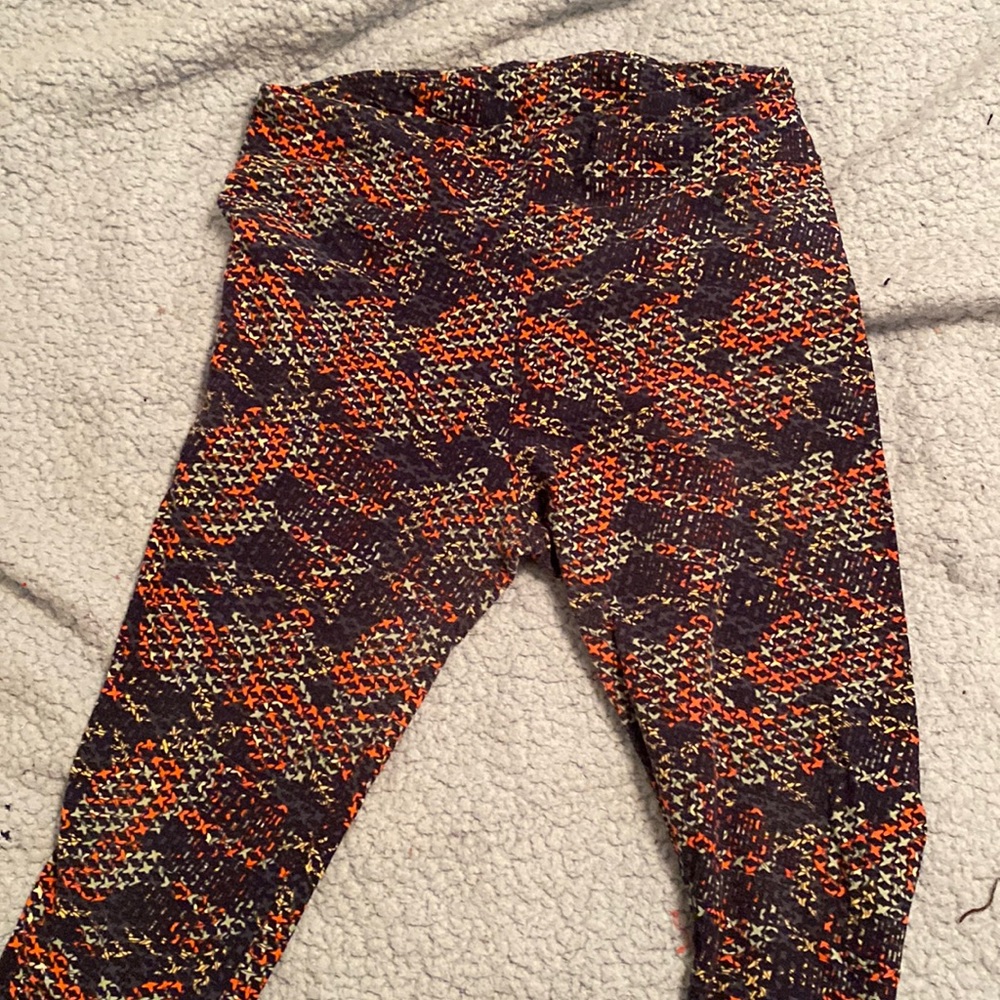 Lularoe leggings in a multi color kind of mesh looking pattern.